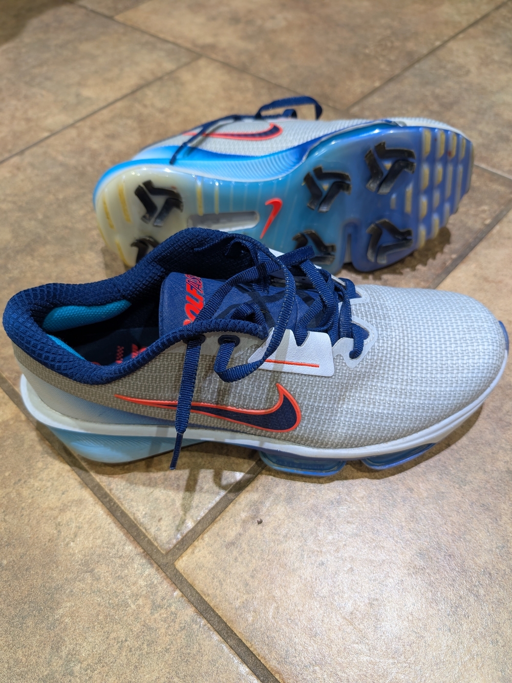 Nike Light Gray and Navy Running Shoes with Orange Swoosh